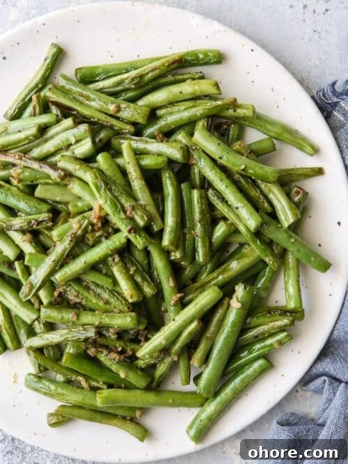 Crispy Oven-Fried Chicken Recipe: Juicy, Golden, and Tender 12 These simple and flavorful buttery garlic green beans are the perfect veggie side dish!