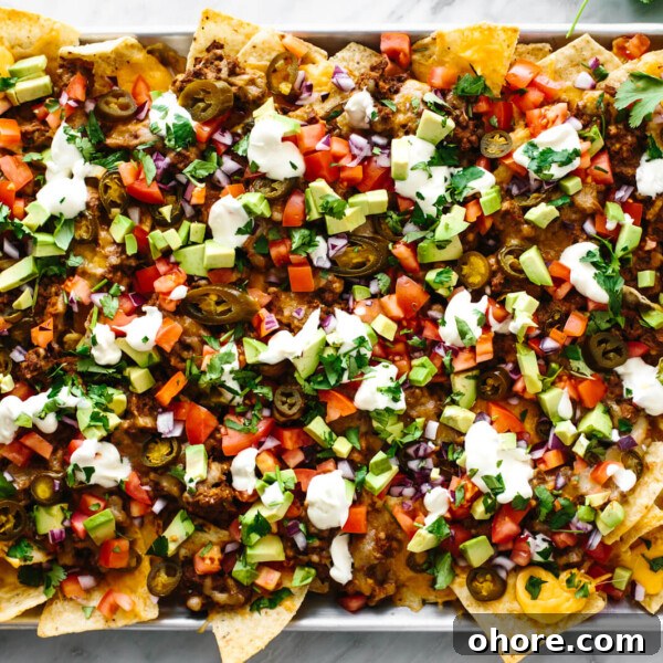 A metal sheet pan with the ultimate nachos