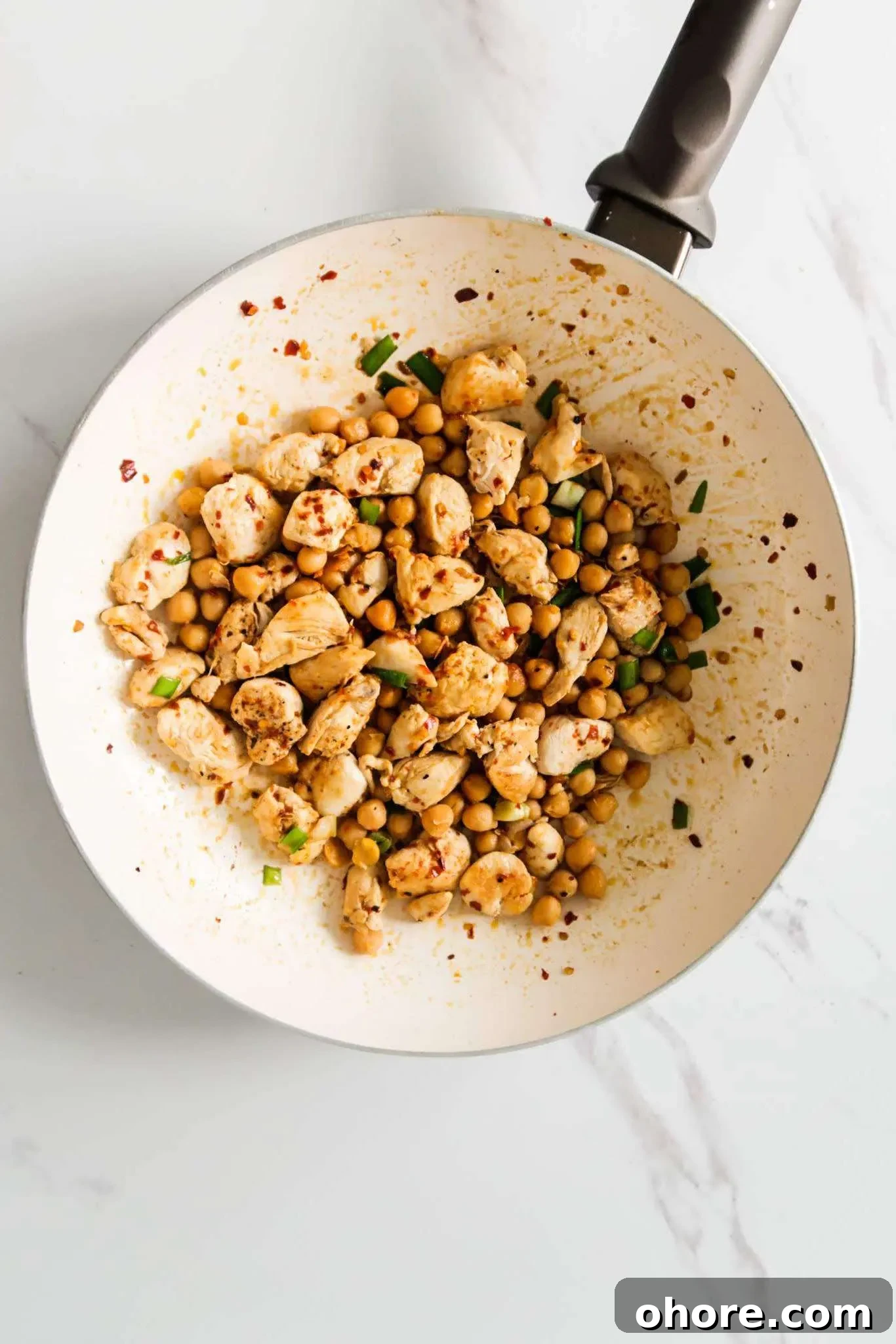 15-Minute Spicy Chicken and Chickpea Skillet (High-Protein, GF) 3 Spicy chicken and chickpeas in a pan