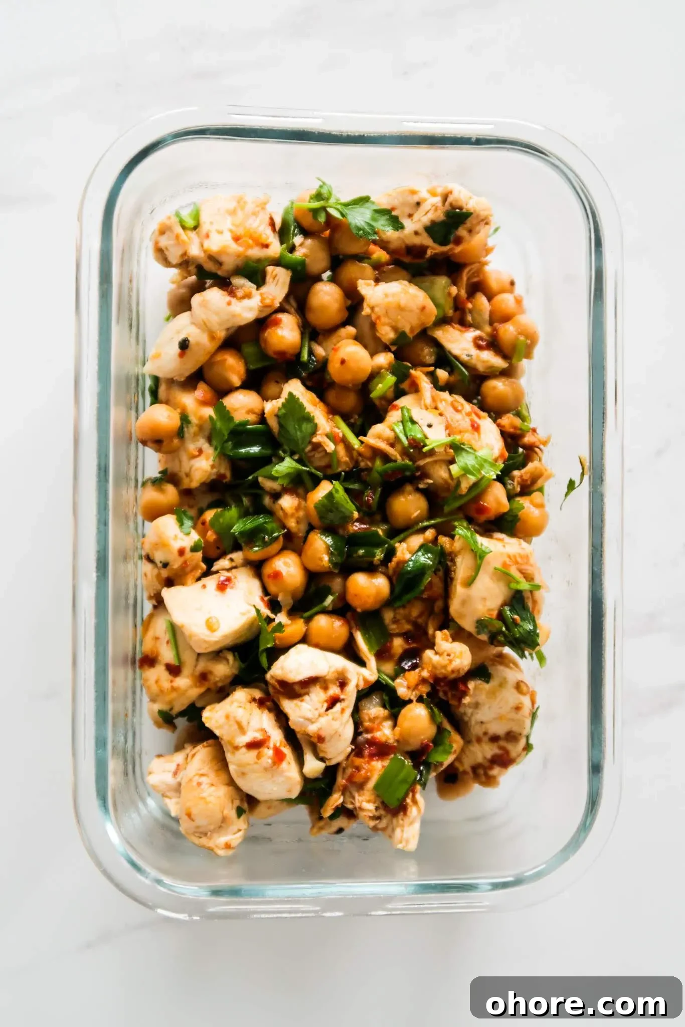Ingredients ready for cooking: chicken, chickpeas, herbs