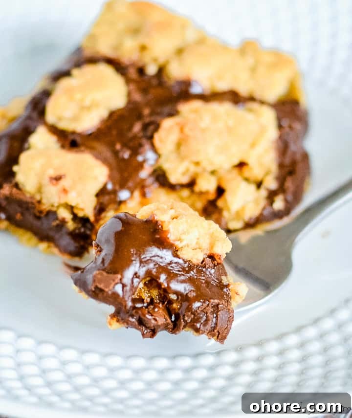 ooey gooey oatmeal fudge bar on a fork