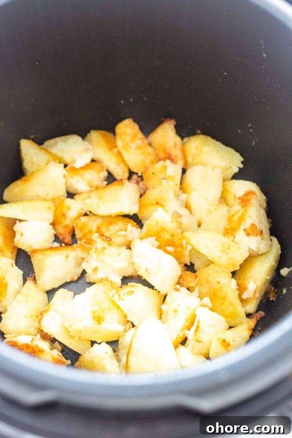 Roasted potatoes baked in a pressure cooker. They are cooked first and roasted second. Easy to make and super-fast.