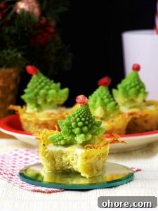 Mini Christmas Tree Quiches: Festive Savory Holiday Appetizers 6 Christmas Tree Mini Quiches with One Quiche Bitten Once in the Foreground