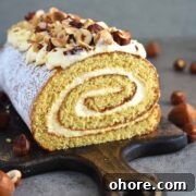 Honey Sponge Roll with Sweetened Condensed Milk Frosting 13 The BEST fluffy and moist Honey Cake Roll that is easier than any cake, filled with scrumptious sweetened condensed milk frosting and topped with hazelnuts for a hint of nutty flavor. This dessert is a family staple and such a crowd-pleaser! olgainthekitchen.com