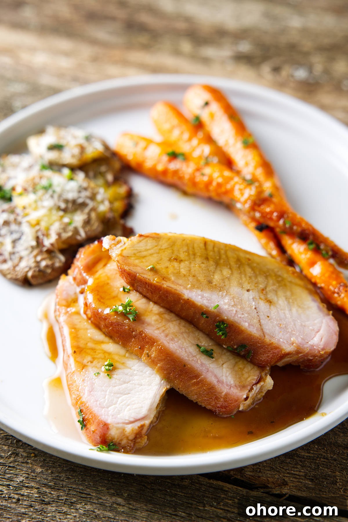Juicy Smoked Pork Loin Recipe for Tender, Flavorful Results 12 smoked pork loin sliced and plated with a glaze drizzled over top
