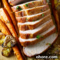 Juicy Smoked Pork Loin Recipe for Tender, Flavorful Results 17 sliced whole smoked pork loin on cutting board