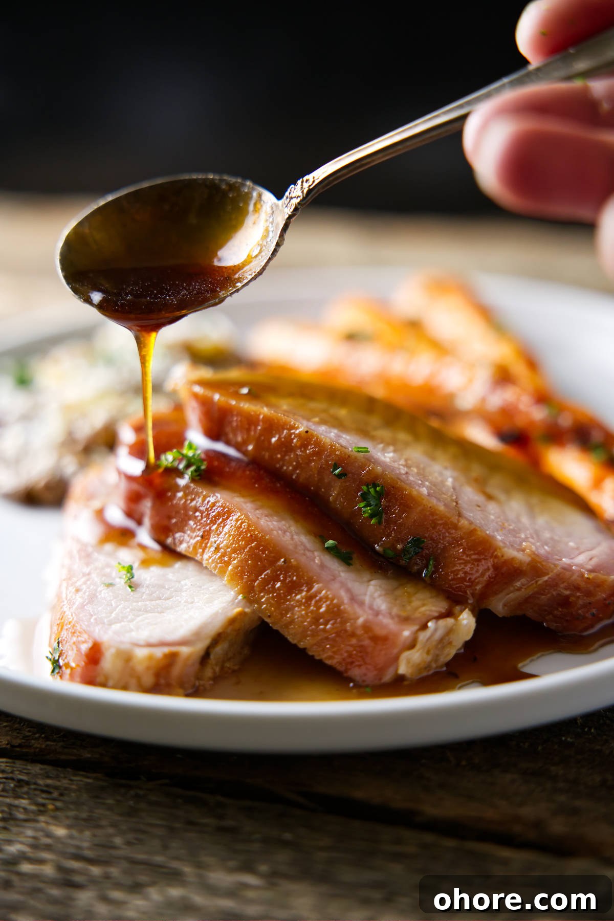Juicy Smoked Pork Loin Recipe for Tender, Flavorful Results 3 drizzling glaze on sliced pork loin