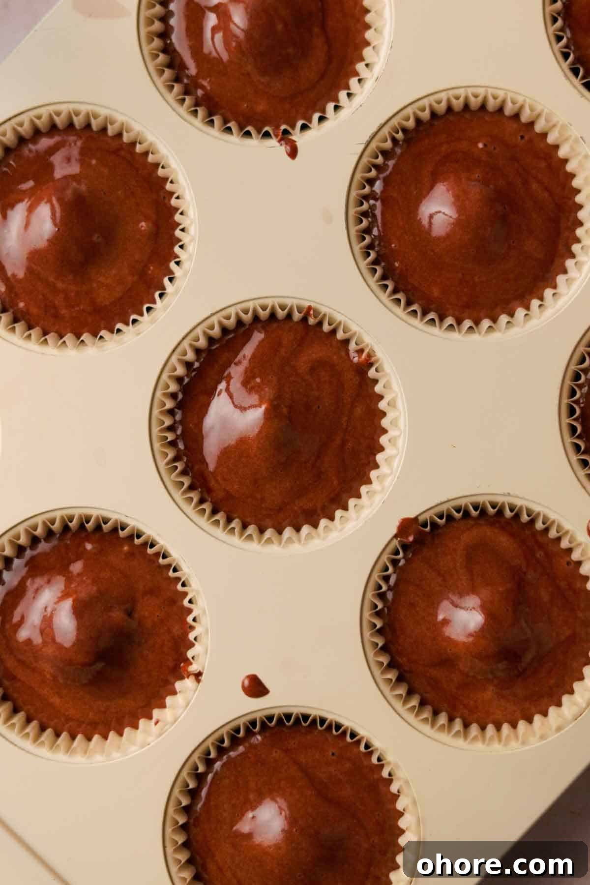 Ferrero Rocher Cupcakes Recipe: Decadent Hazelnut Chocolate Cupcakes 12 chocolate cupcake batter in paper cups in muffin tin