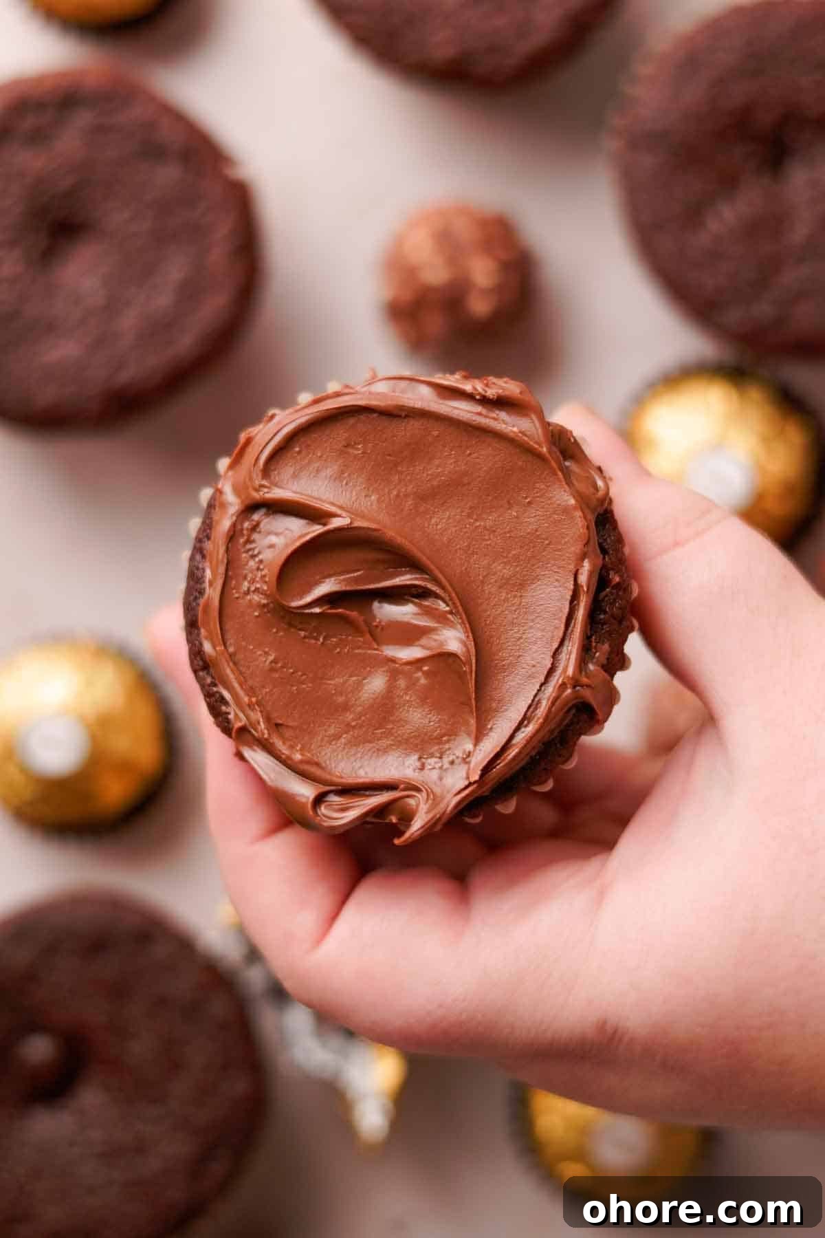 Ferrero Rocher Cupcakes Recipe: Decadent Hazelnut Chocolate Cupcakes 17 chocolate cupcake with nutella spread on top