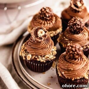 Ferrero Rocher Cupcakes Recipe: Decadent Hazelnut Chocolate Cupcakes 24 chocolate cupcakes with nutella frosting topped with ferrero rocher chocolate