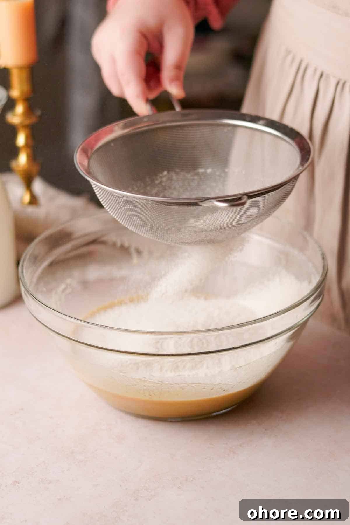 Ferrero Rocher Cupcakes Recipe: Decadent Hazelnut Chocolate Cupcakes 9 sifting flour into a large glass bowl with a wire sieve