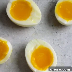 Perfect Jammy Eggs Recipe: Soft-Boiled Egg Guide 8 The perfect jammy egg on the counter.