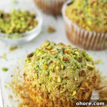 close-up pistachio muffin with more in the background