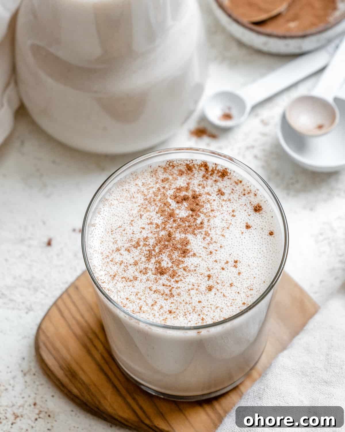 completed Easy Vegan Eggnog on a brown and white surface