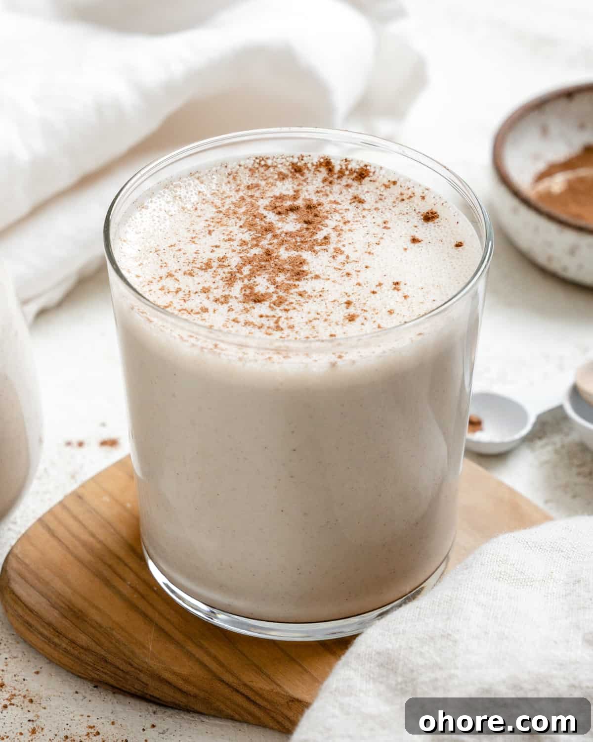 completed Easy Vegan Eggnog on a brown and white surface