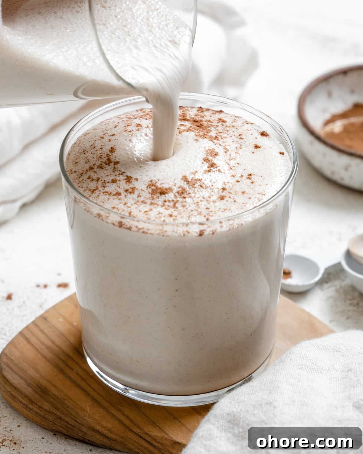 completed Easy Vegan Eggnog on a brown and white surface