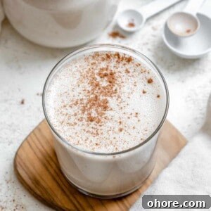 completed Easy Vegan Eggnog on a brown and white surface