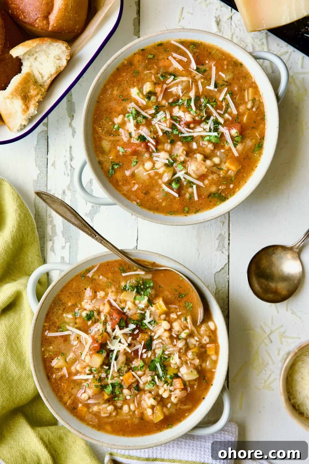 Hearty Vegetable and Barley Soup Recipe for Comforting Meals 2 Two bowls of Vegetable Barley Soup on white distressed background.