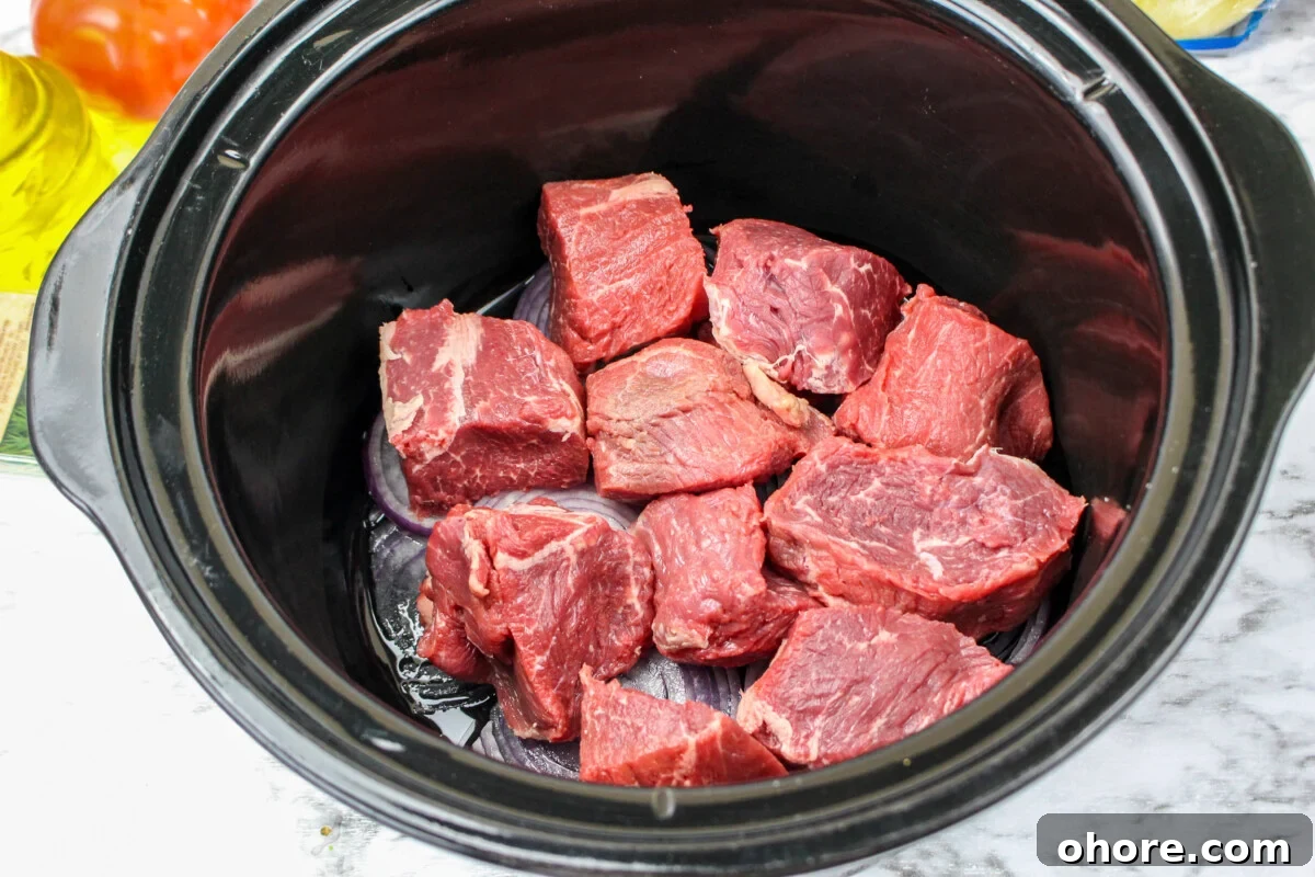 Slow Cooker Beef Gyros Recipe: Tender, Flavorful Greek Sandwiches 5 chunks of a roast on top of the onions.