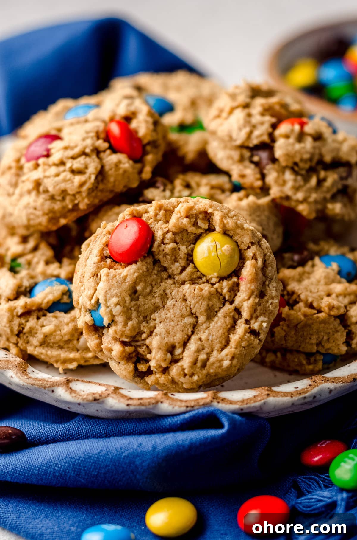Ultimate Monster Cookie Recipe for Chewy, Loaded Cookies 14 monster oatmeal cookies on a plate