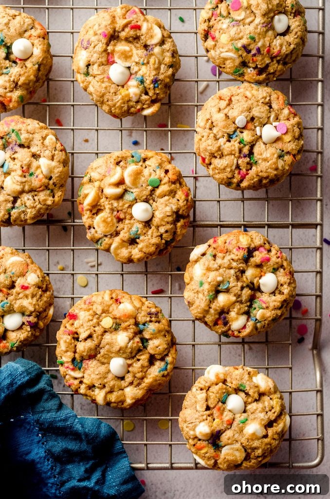 Ultimate Monster Cookie Recipe for Chewy, Loaded Cookies 19 aerial photo of funfetti oatmeal cookies on a cooling rack