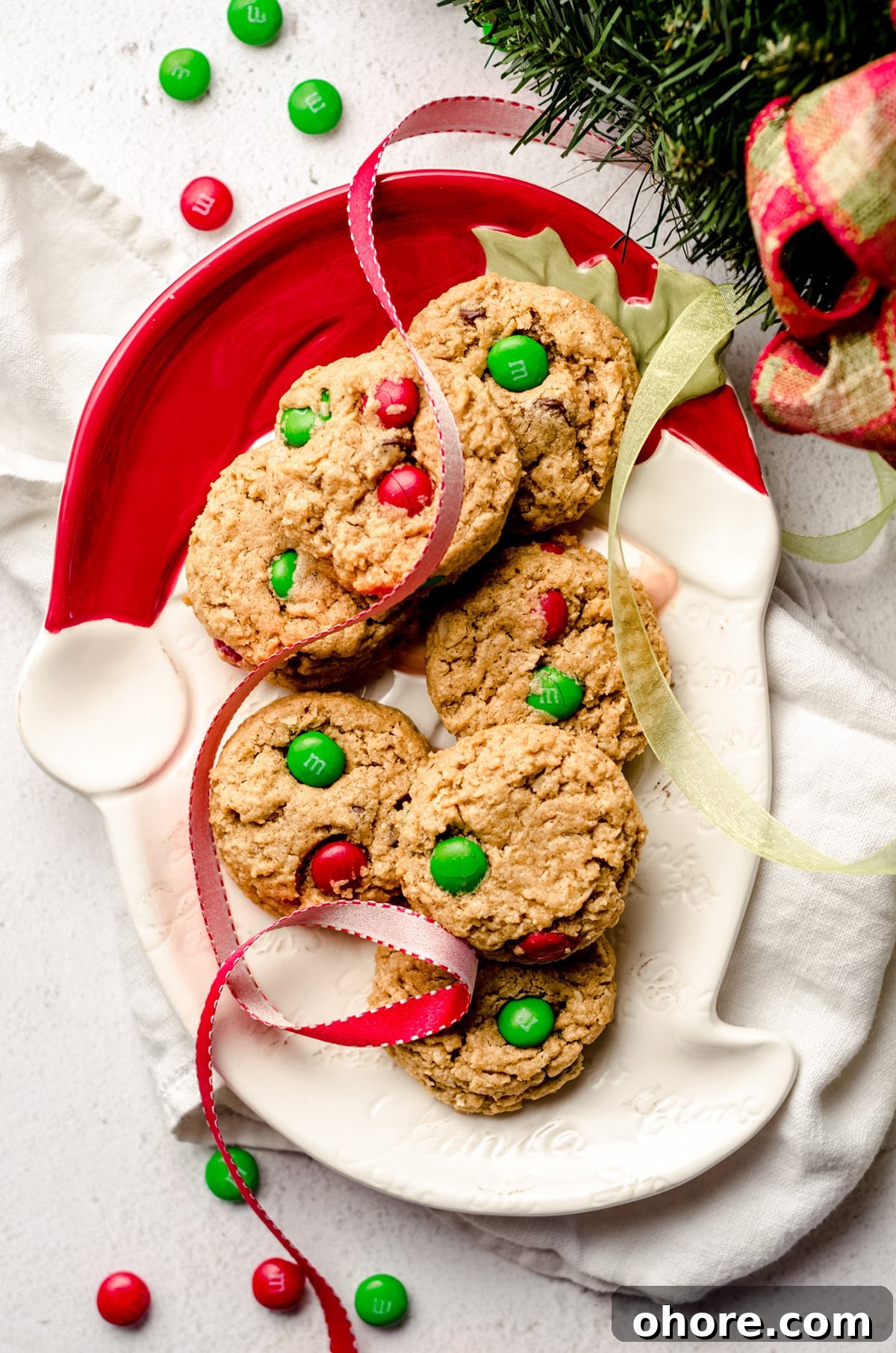 Ultimate Monster Cookie Recipe for Chewy, Loaded Cookies 6 christmas monster cookies on a santa plate