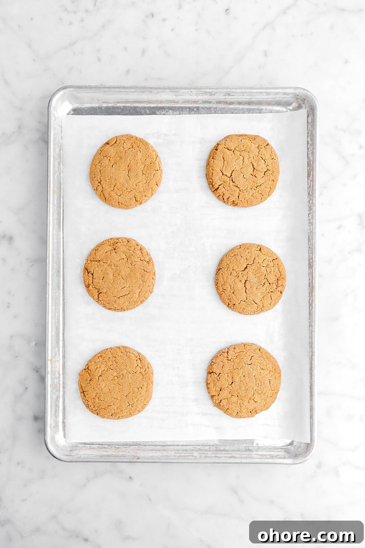 Gingerbread Sandwich Cookies Recipe for Holiday Parties 7 six baked cookies on lined sheet pan.