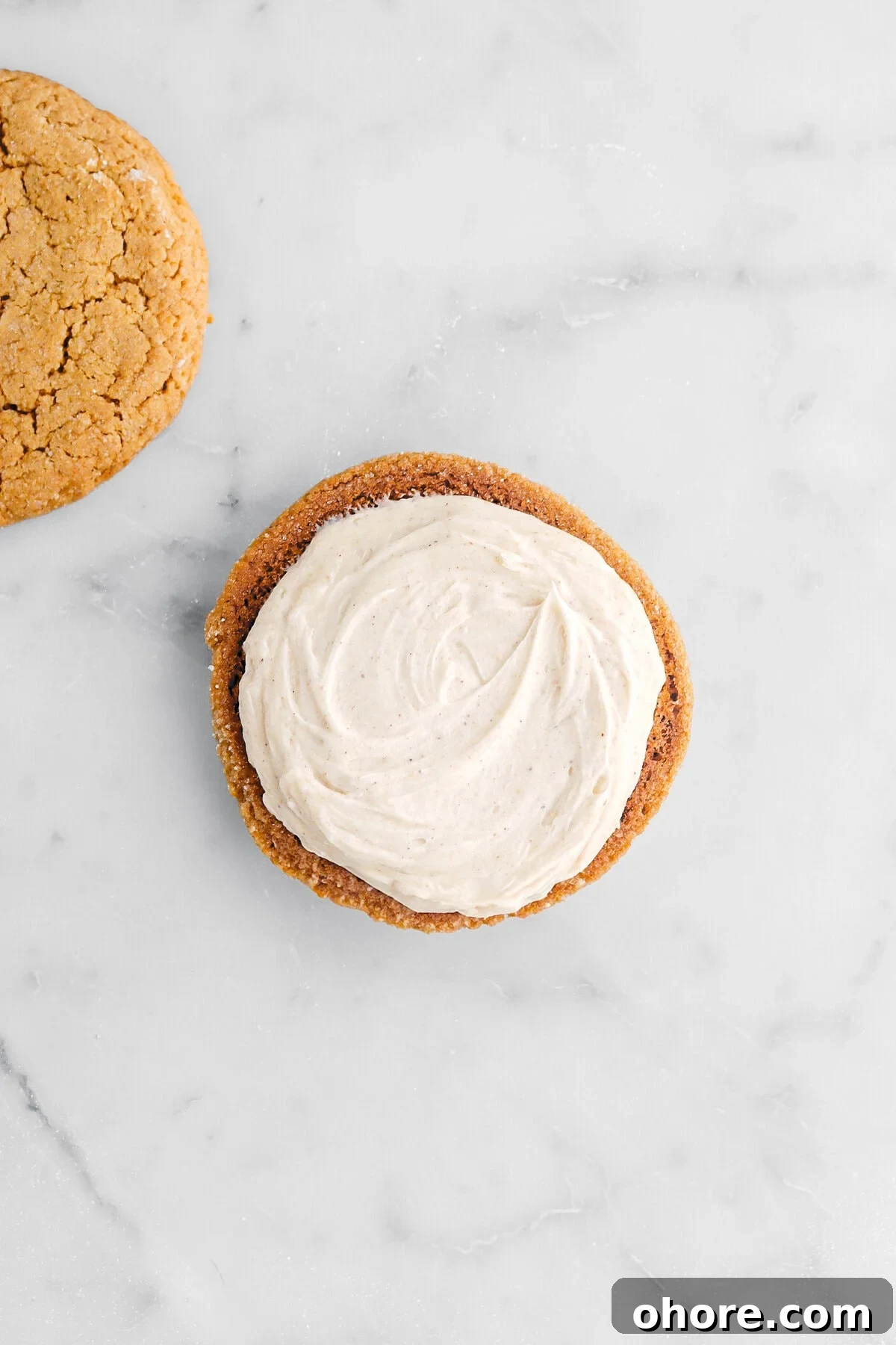 Gingerbread Sandwich Cookies Recipe for Holiday Parties 9 frosting on bottom of upside down cookie.