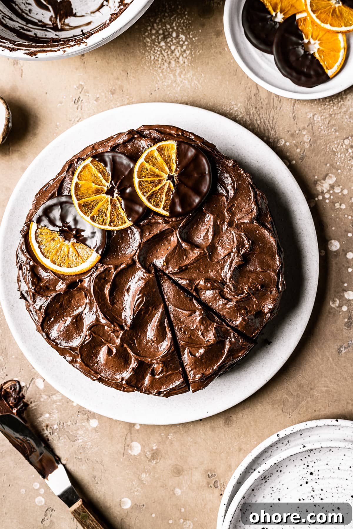 Decadent Chocolate Orange Cake Recipe for Irresistible Flavor 5 A cake with chocolate frosting with one slice cut.