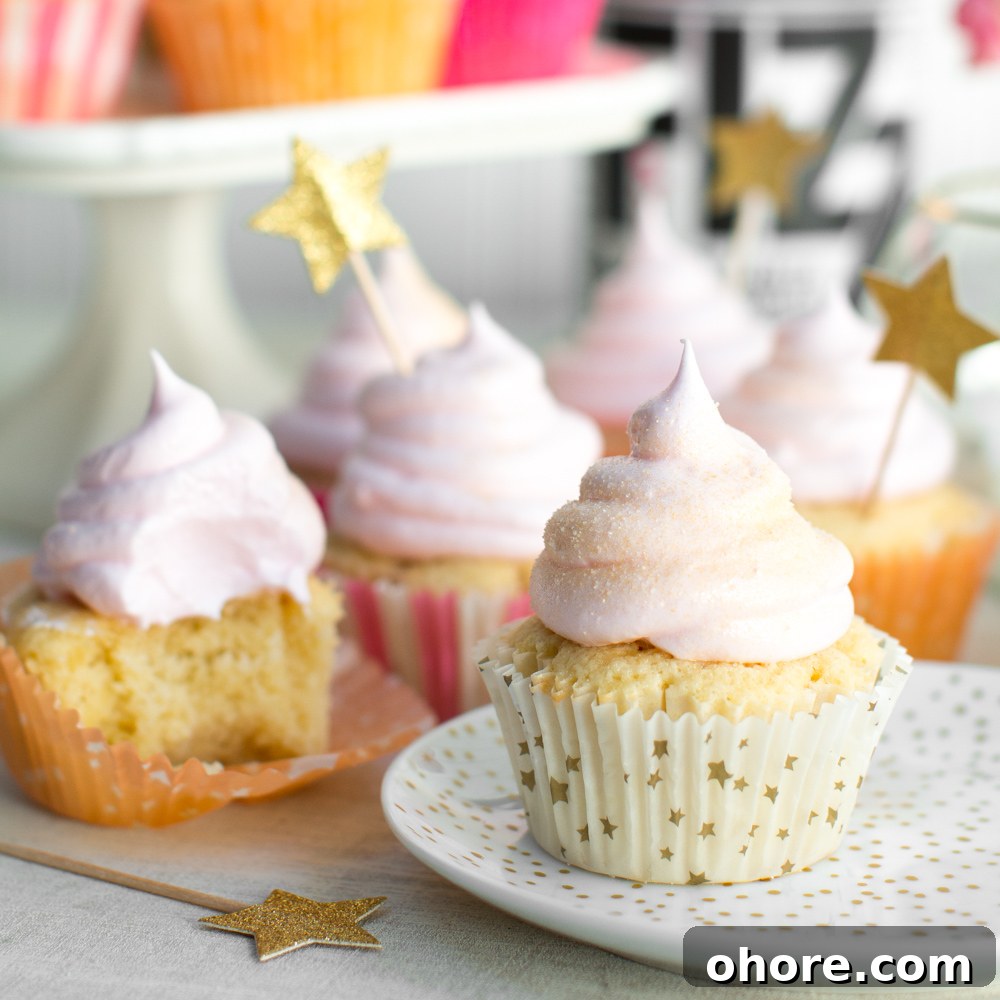 a close up shot of pink champagne meringue cupcakes