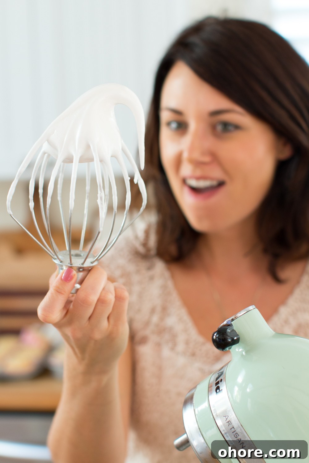 Becky Sue marvels at the meringue on the whisk