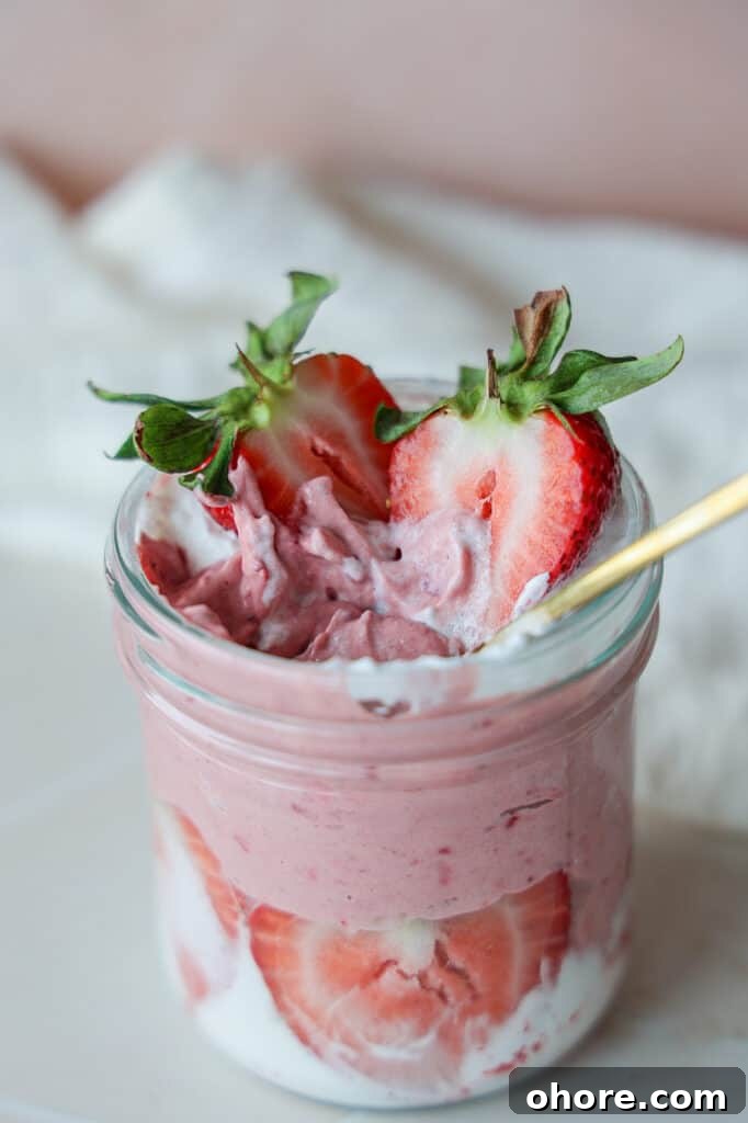 Strawberry yogurt mousse with whipped coconut cream.