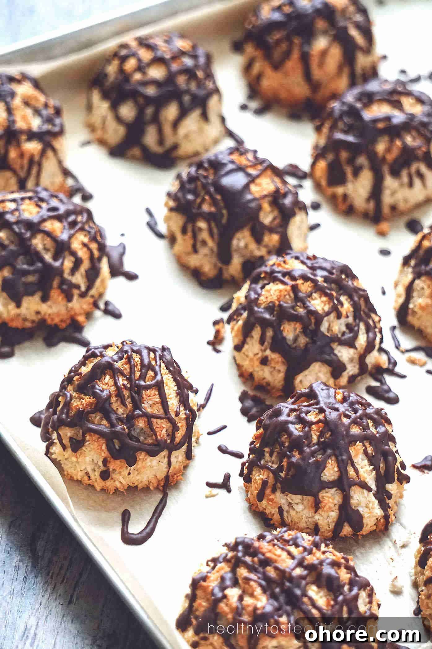 Overhead shots of baked dairy free gluten free coconut macaroon recipe without condensed milk, drizzled with chocolate.