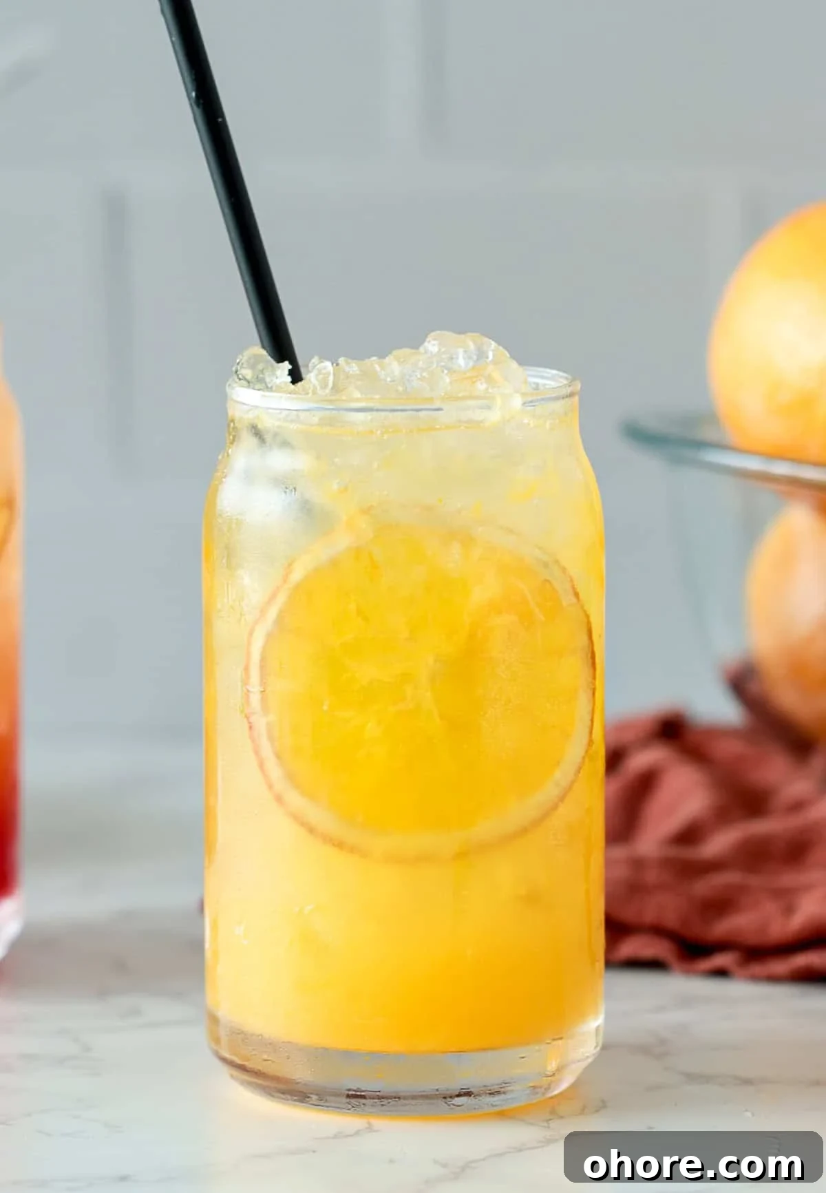 Orange Crush Cocktail Recipe: Fresh Vodka, Orange & Sparkling Mix 2 Orange crush cocktail with black straw and orange slice.