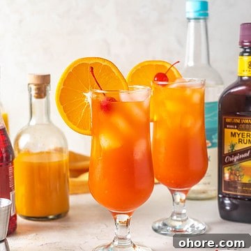 Hurricane cocktail on table.