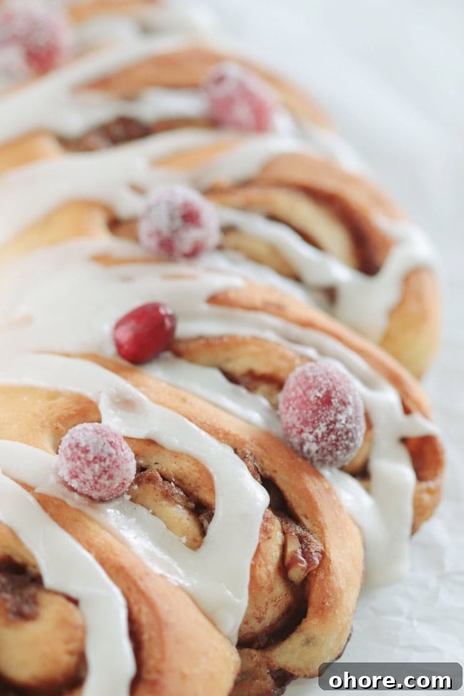 Video Guide: Sugared Cranberries Recipe with Step-by-Step Tips 4 cinnamon rolls with sugar cranberries on top