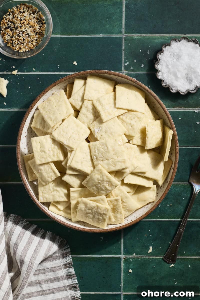 Crispy Sourdough Discard Crackers Recipe for Zero-Waste Snacking 2 Sourdough Discard Crackers in a bowl.