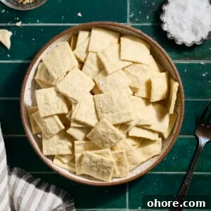 Crispy Sourdough Discard Crackers Recipe for Zero-Waste Snacking 13 Sourdough Discard Crackers in a bowl.
