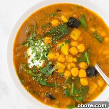 A top down view of a bowl of Moroccan chickpea soup.