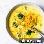 Creamy Broccoli Cheddar Soup Recipe for Cozy Comfort Meal 15 A top down view of a bowl of broccoli cheddar soup.