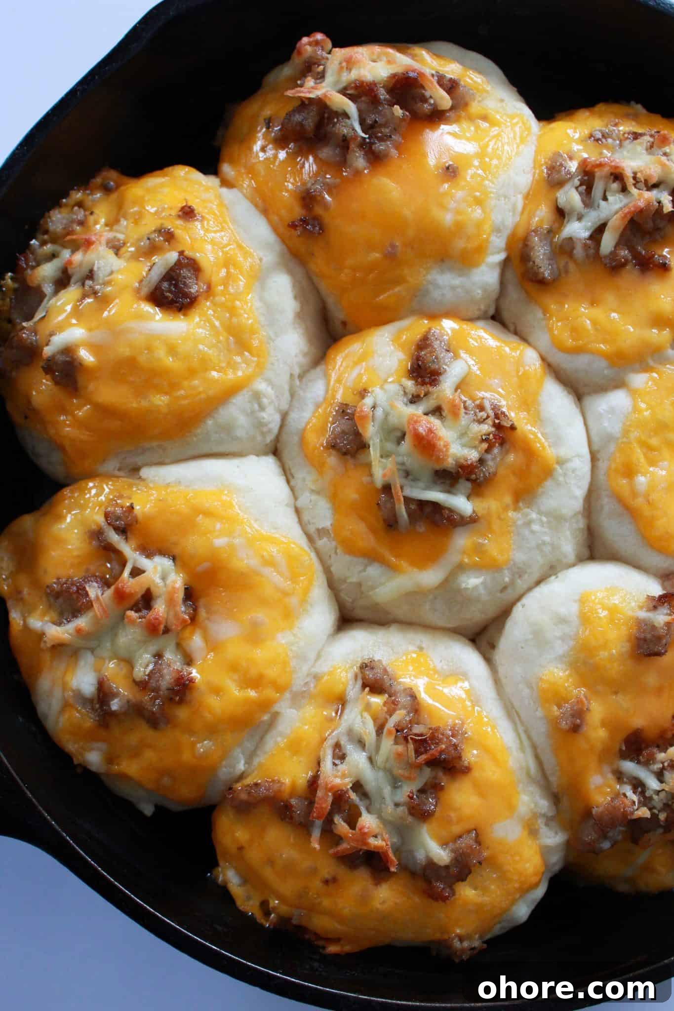 What to Make for Breakfast: 7 Quick Breakfast Recipes You’ll Love 6 What to Make for Breakfast? 7 Quick and Easy Breakfast Recipe Ideas You'll Love featured by top US food blog, Practically Homemade: skillet sausage and cheese biscuit