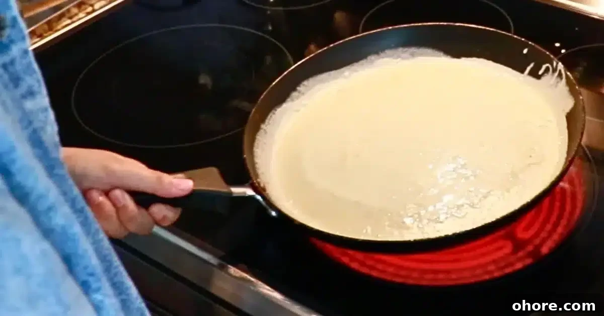 spread crepe batter over a hot pan
