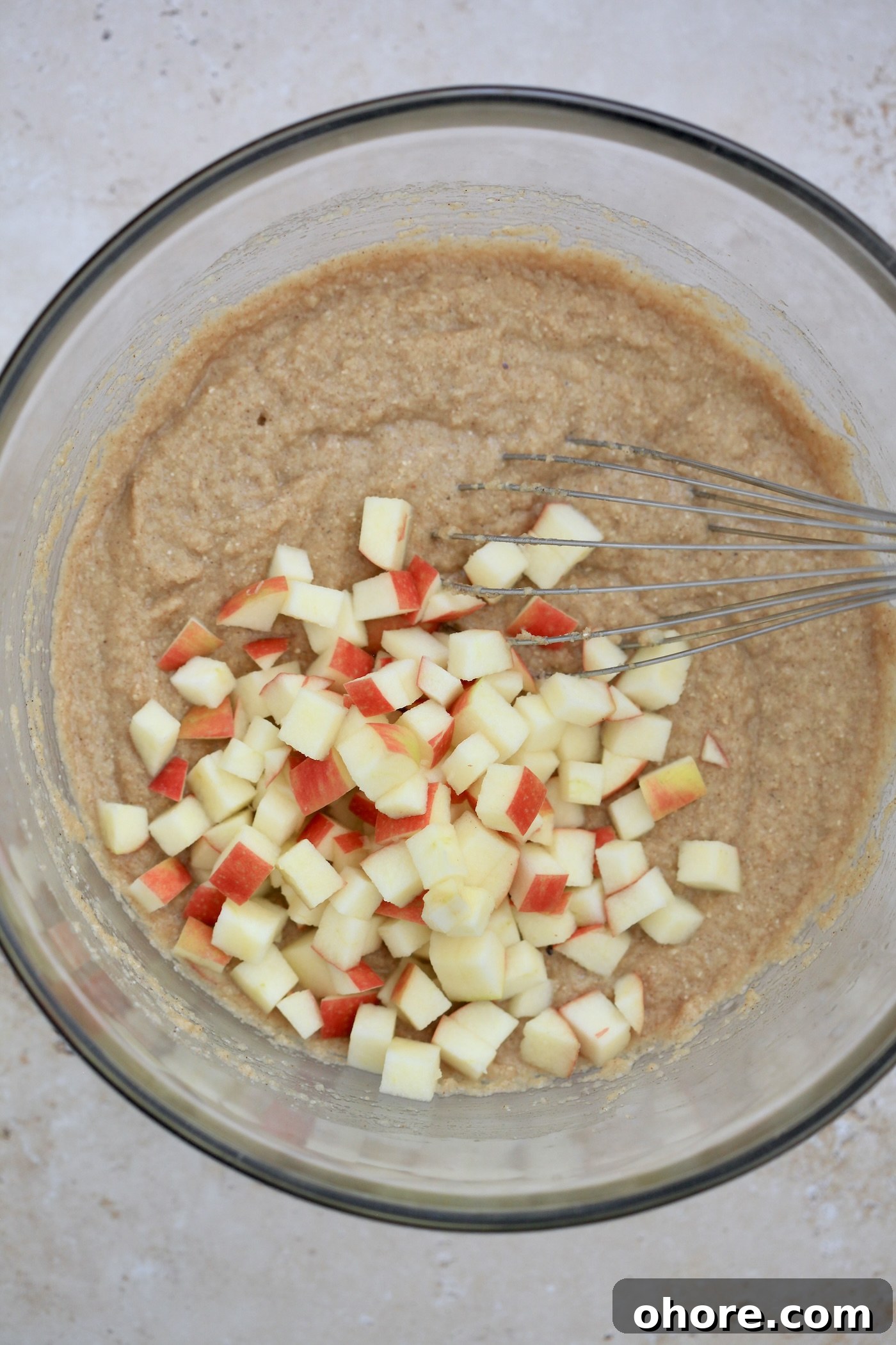Almond Flour Apple Muffins: Fluffy, Gluten-Free Recipe 5 batter in mixing bowl with apples.