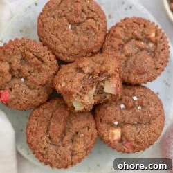 plate of brown muffins with bite taken out