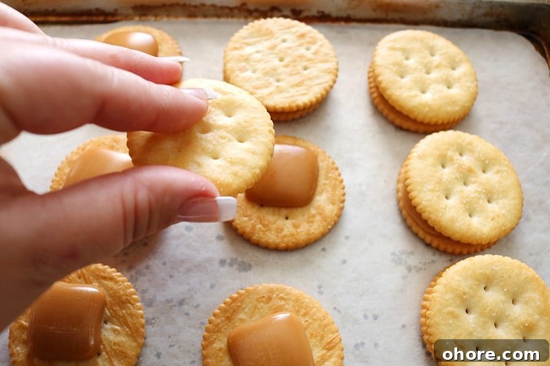 hand putting together crackers. 
