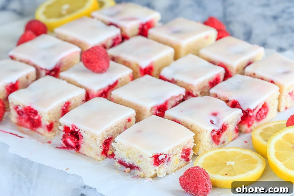Raspberry Lemon Blondies Recipe with Tangy Glaze 2 Fast and easy to make, these chewy raspberry lemon blondies are just the right mix of tart and sweet - and will disappear way too quickly!