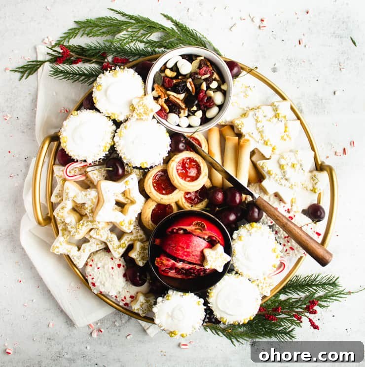 How to Build a Stunning Cookie Board for Parties and Gifts 4 large, round cookie board with fresh fruit, cookies and trail mixe