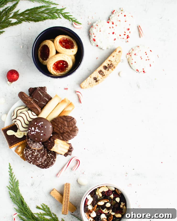 How to Build a Stunning Cookie Board for Parties and Gifts 5 cookies on a plate with other cookies strewn around it