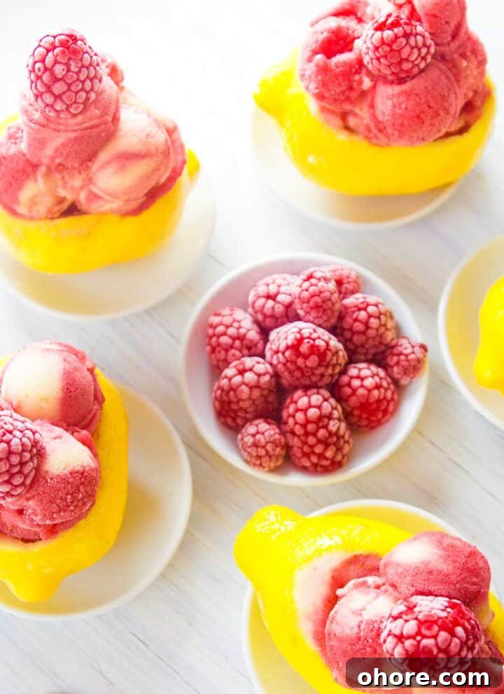 Raspberry lemon sorbet in lemon shells.