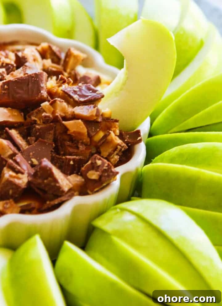 Salted caramel apple dip with apple slices.